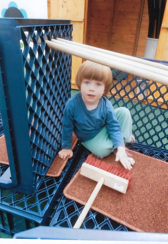 hook-a-gate nursery toddler playing outdoors on the playground